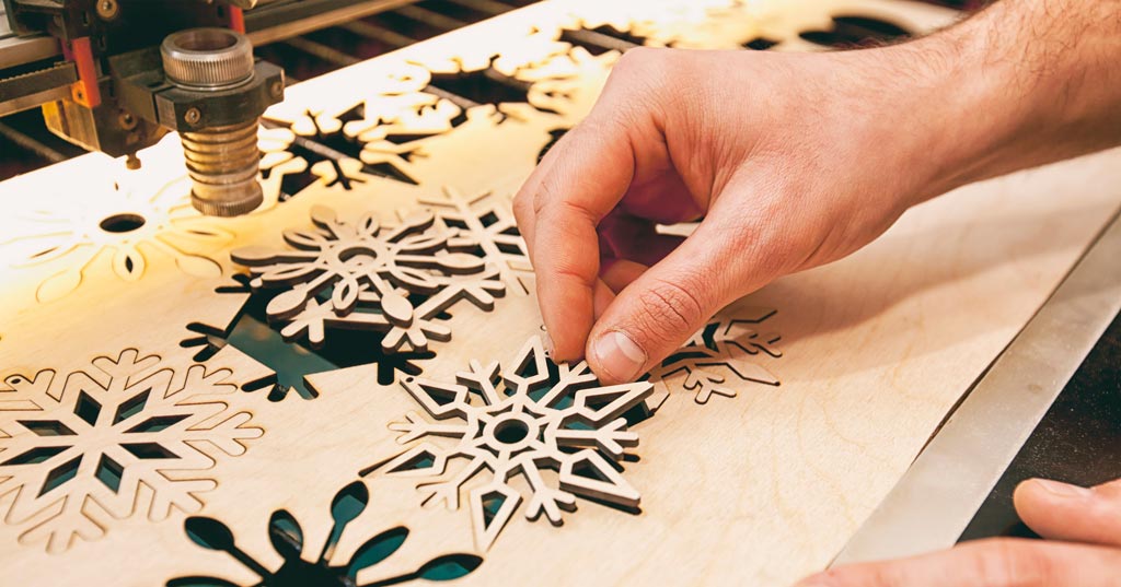 Cutting snowflakes from wood with a laser cutter