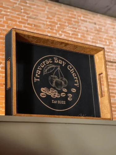 wood tray with black leather insert with engraved logo